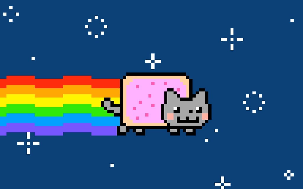 Image of the Nyan Cat Non Fungible Token, a cat with a pop tart body shooting out of a rainbow 
