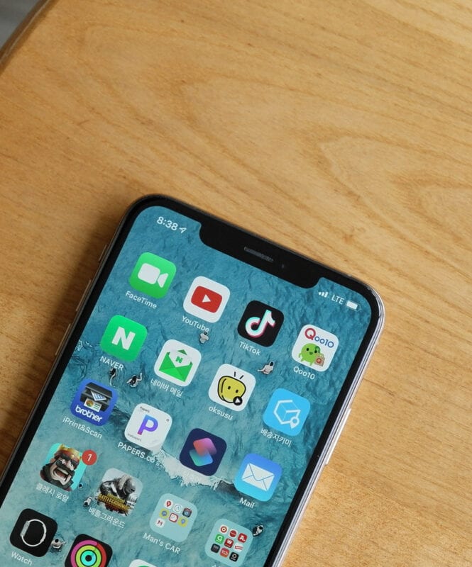 This is a photo of an iPhone screen displaying the TikTok app on the home page. This is the first step for advertising on TikTok 