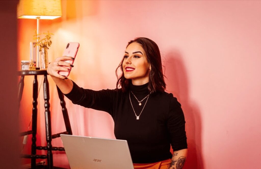 Woman taking a selfie - nano influencer