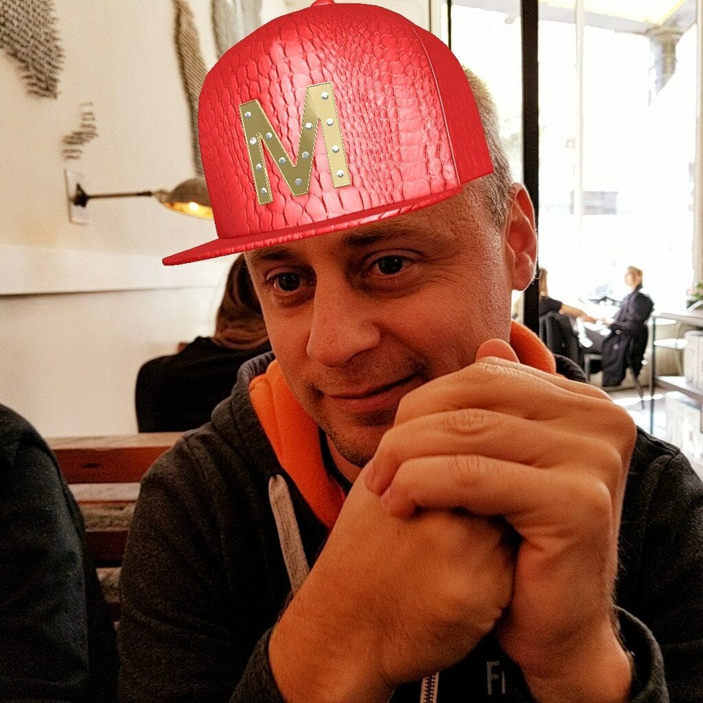 This image shows a man wearing a hat which has been superimposed onto him using augmented reality (AR). 