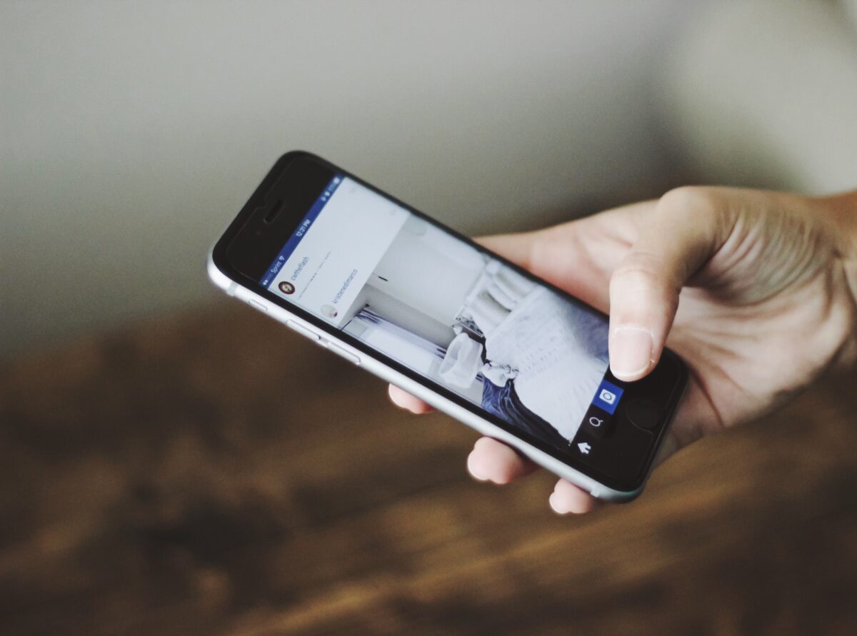 Picture of Hand Scrollin Instagram App on Smartphone