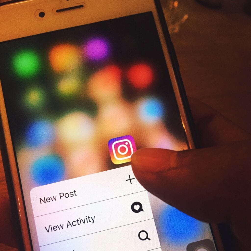 Tapping Instagram App on Smartphone