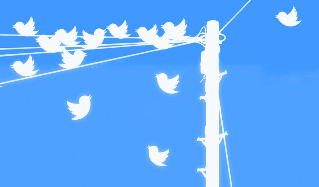 Twitter inspired image if tweets as birds on a telephone wire