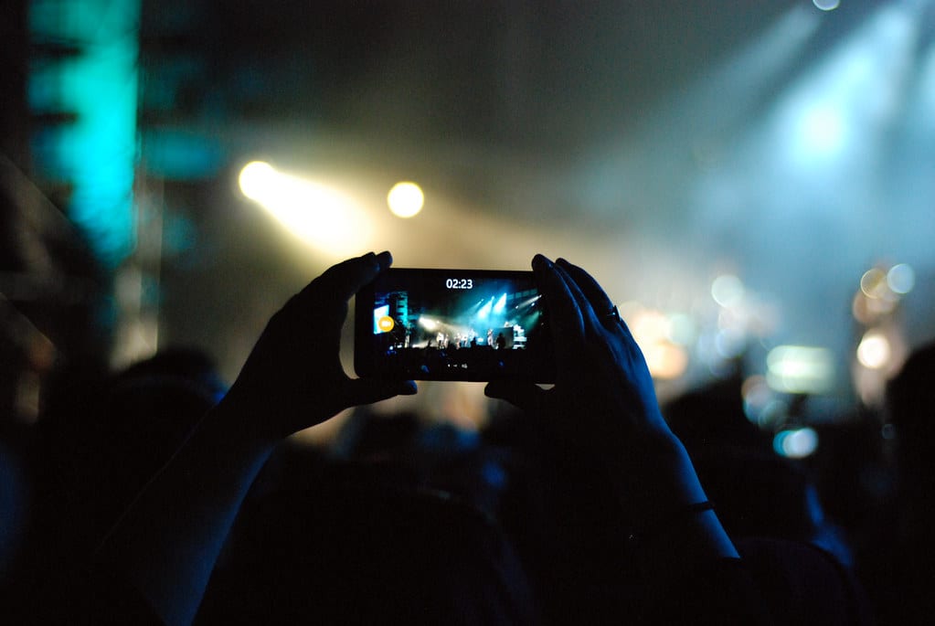 Image of Person Videoing a Concert on Their Smartphone