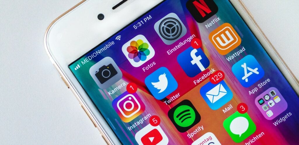 An iPhone home screen with various social media apps, Facebook, Twitter, Instagram and Youtube. Generated captions can help improve digital accessibility